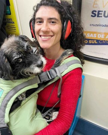 XRainbow Rafa Beleze riding public transportation with her dog, Nina.