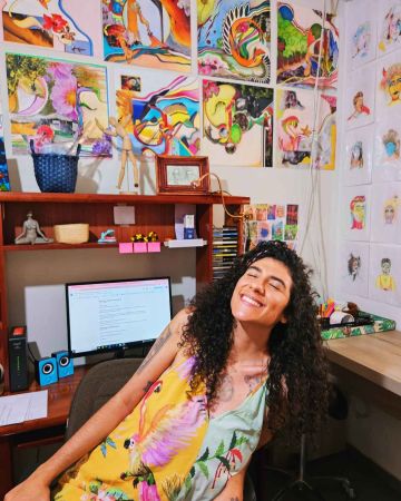 xRainbow Rafa Beleze smiling in her art studio.